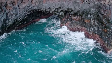 Powerful ocean waves in the volcanic cliffs of Los Hervideros in Lanzarote, Canary Islands.