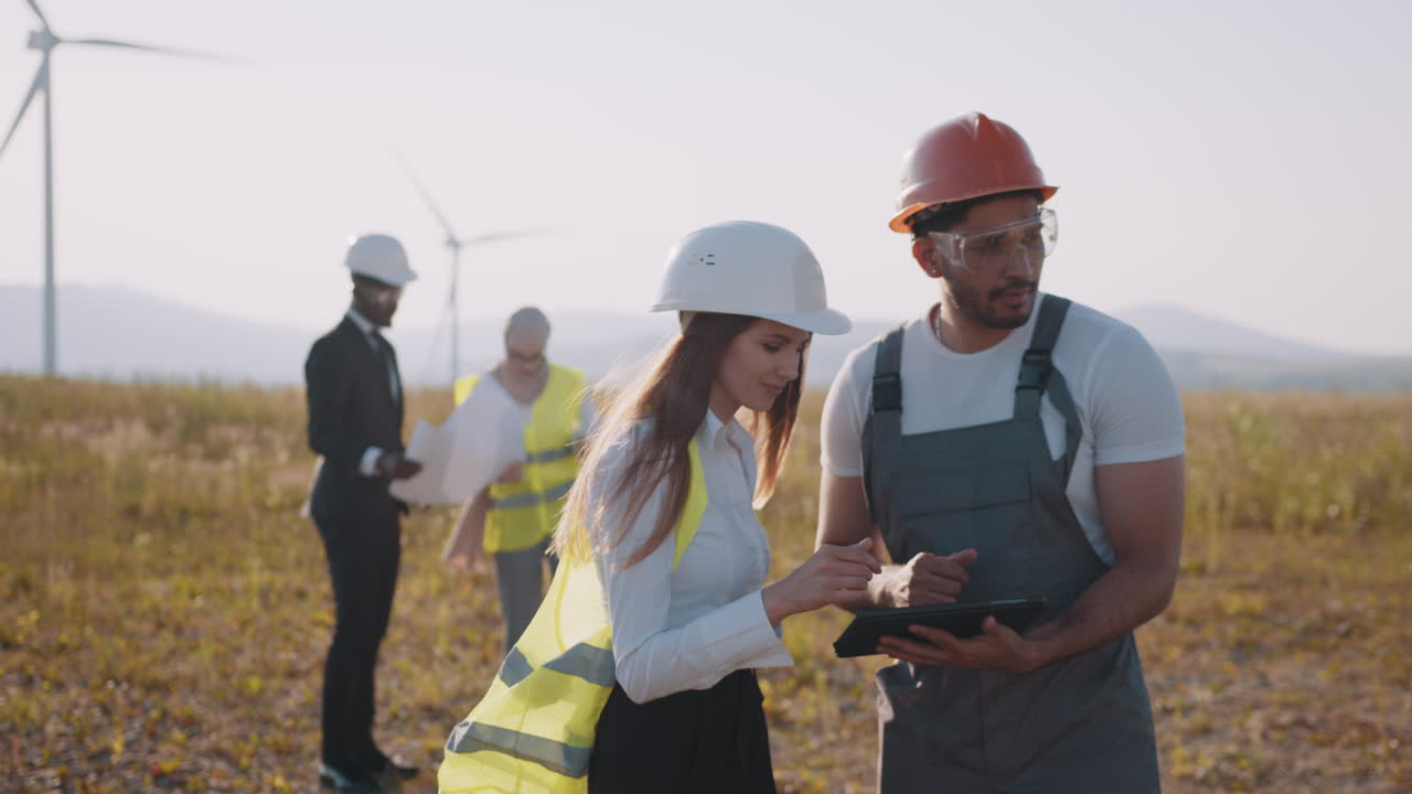 Wind Farm Engineers Reviewing Project Plans