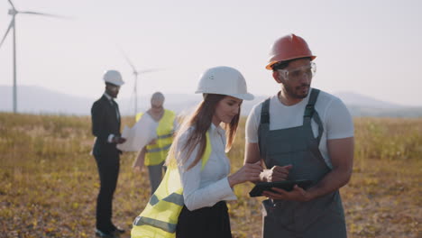 wind farm engineers reviewing project plans