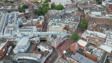 Pull-back-drone-aerial-reverse-reveal-pedestrian-shopping-street-Reading-UK