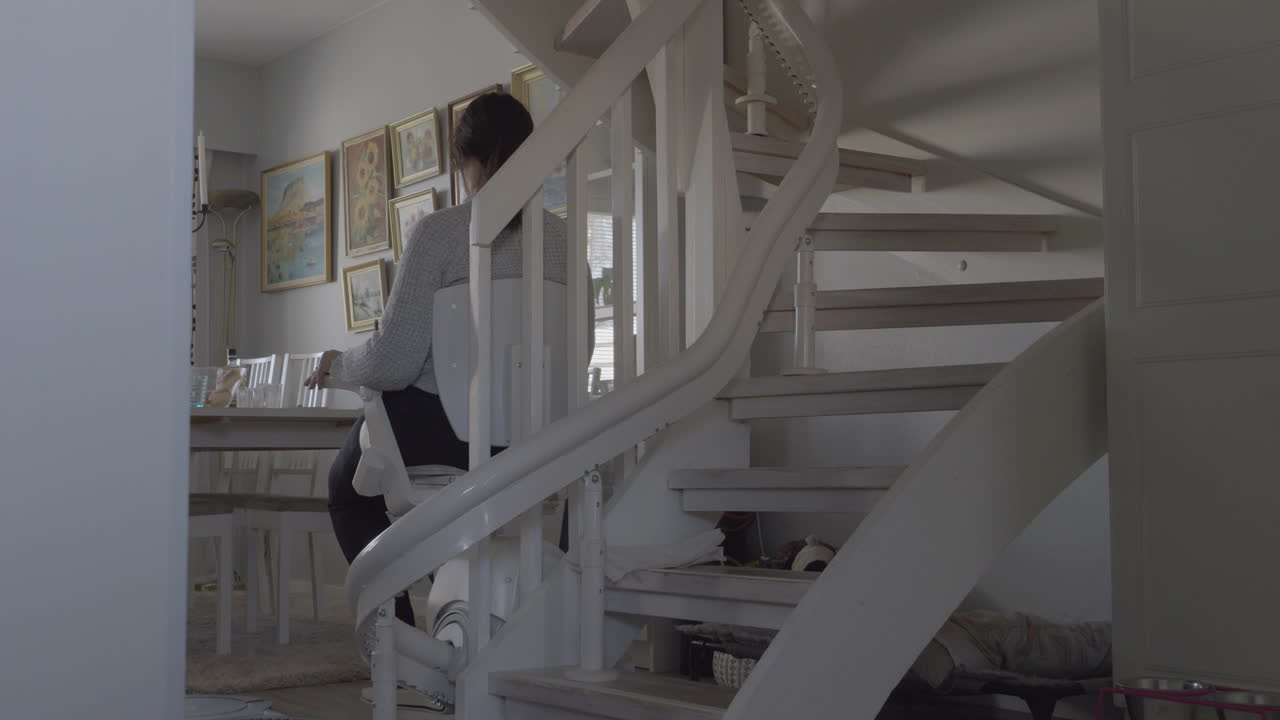 Young female disability pensioner using equipment at home, 4k video