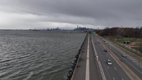 an aerial view over the paved walkway along the belt parkway by upper bay in brooklyn ny