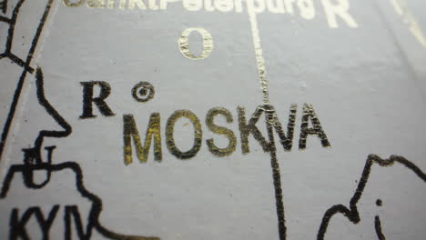 map of moscow, saint petersburg and kyiv on globe