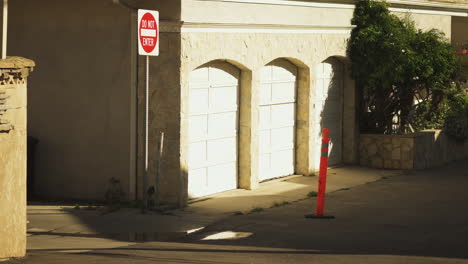 Skateboarder walking into forbidden territory and peeks out to see that nobody watching