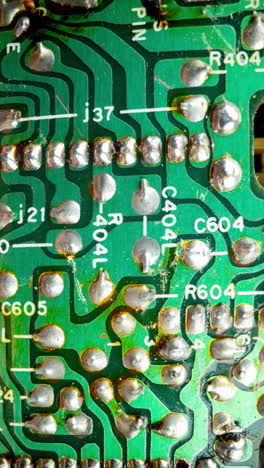 a macro shot of a circuit board in vertical