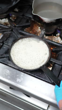 cooking pancakes in a kitchen