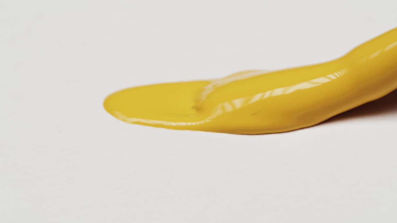 Yellow paint on white background
