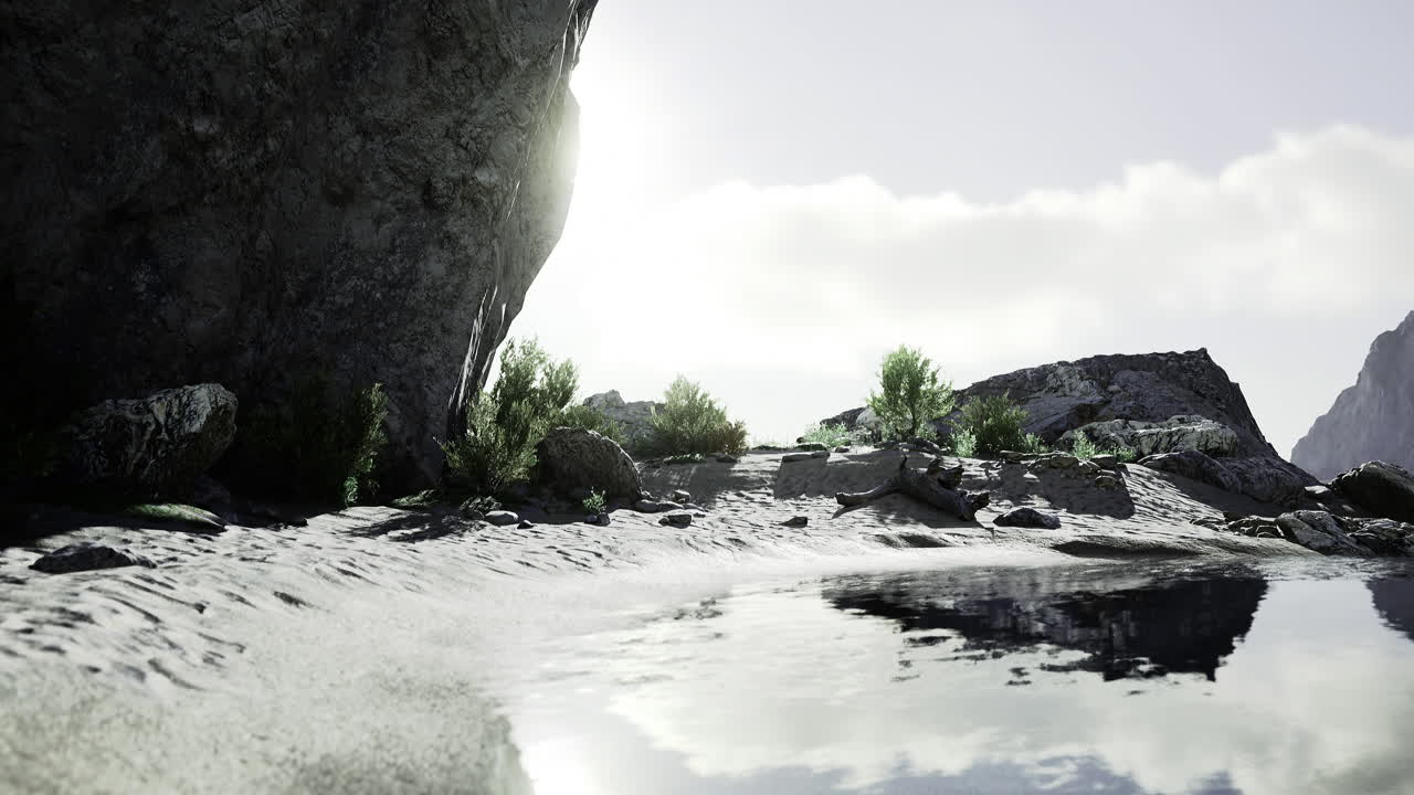 Natural landscape with sunlight reflecting on tranquil water near rocky terrain