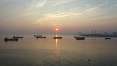 sunrise over a busy harbor