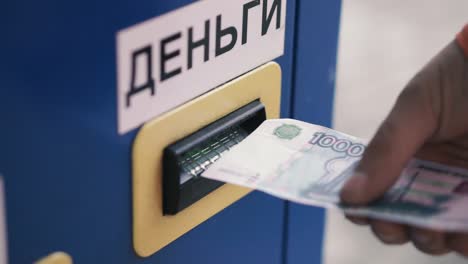 paying with hand at a machine