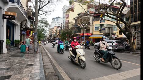 motorbikes and pedestrians in a busy city