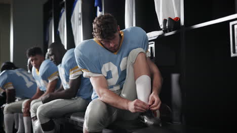 football team preparing in locker room