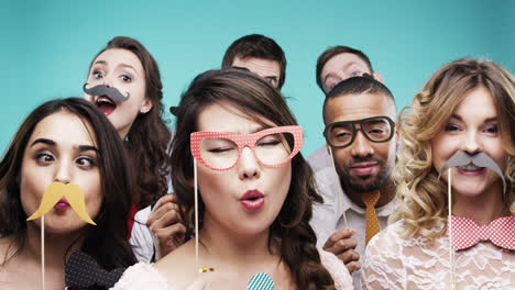 multi racial group of funny people celebrating slow motion party photo booth