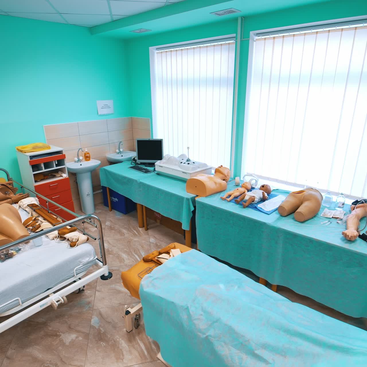 Medical dummies in university room. Practice and training room for young doctors in medical simulator