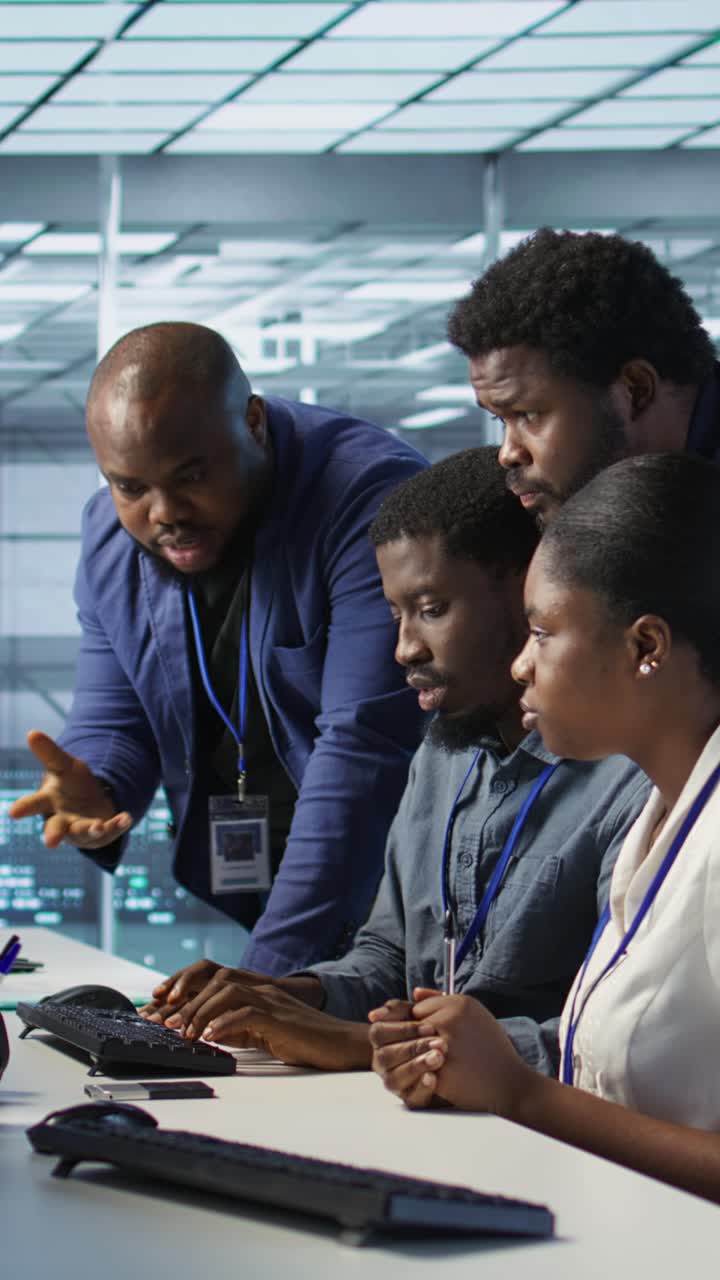 Vertical video Coworkers in data center doing brainstorming, implementing AI