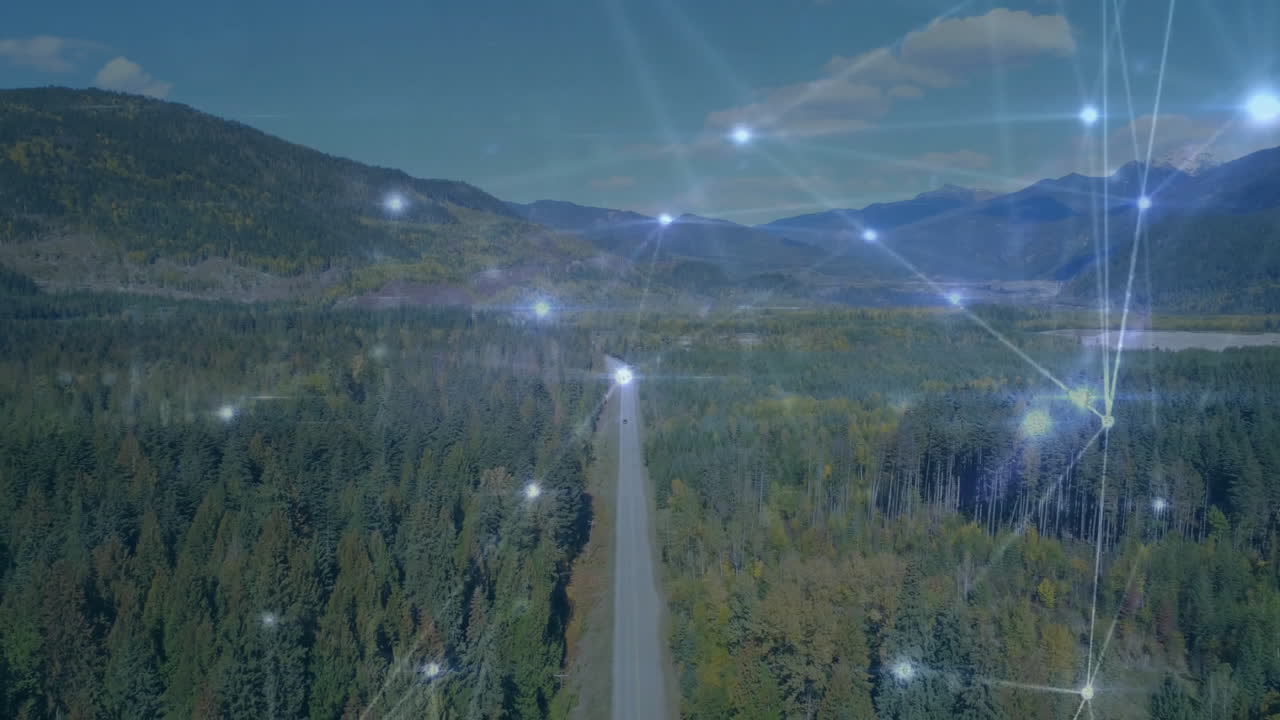 Data processing and network connections animation over forested mountain landscape