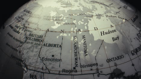 close-up of a world globe focusing on canada