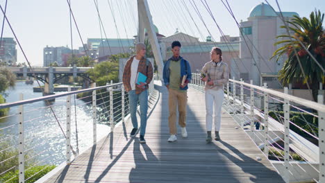 students walking on campus bridge