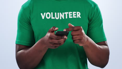 Volunteer-face,-phone-and-happy-black-man-typing