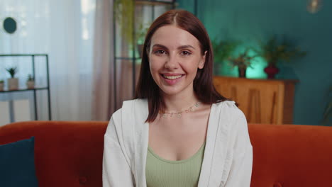 Close-up-portrait-of-happy-smiling-caucasian-woman-in-shirt,-looking-at-camera,-celebrate-good-news