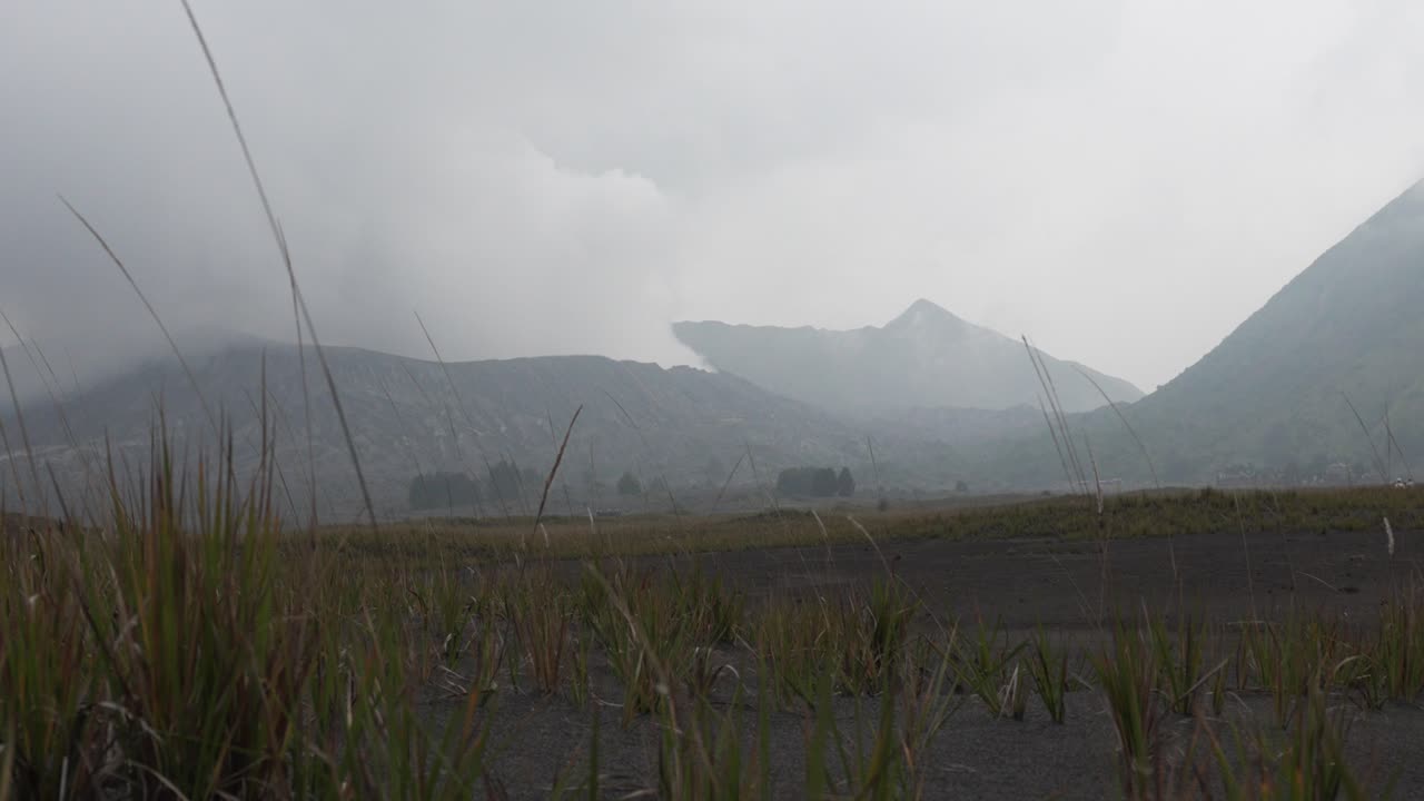 Tengger mountains Bromo active volcano covered in toxic plume Java Indonesia volcanic landscape