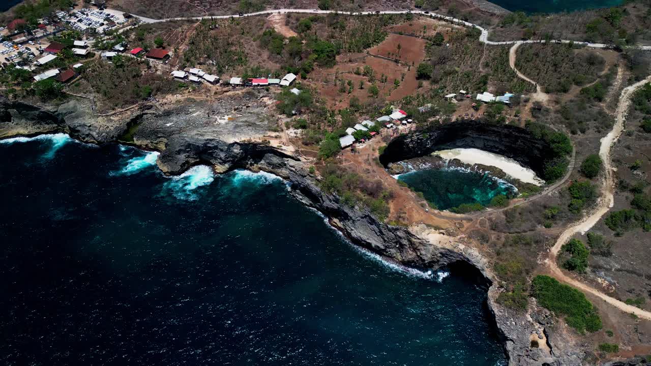 Broken Beach on Nusa Penida is a spectacular coastal formation with a giant hole in the cliff where the sea flows through creating a unique and unforgettable island experience for visitors.