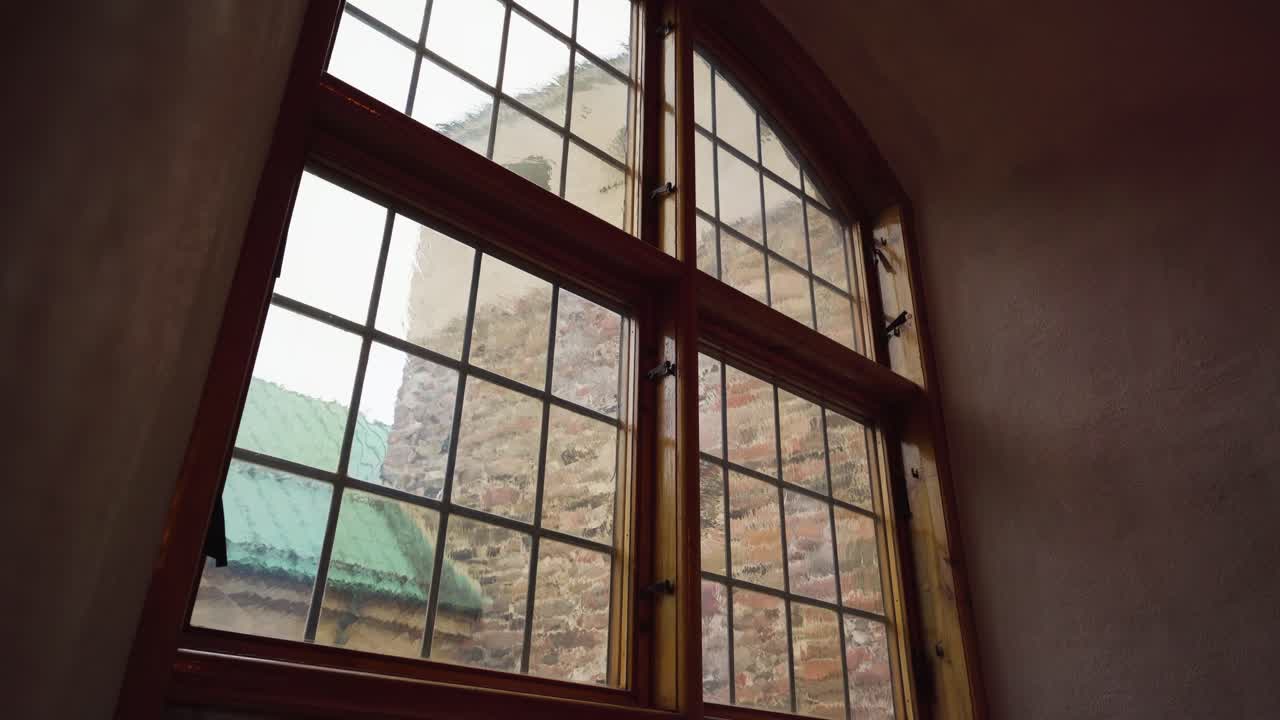 Old window in a medieval castle. Reveal shot