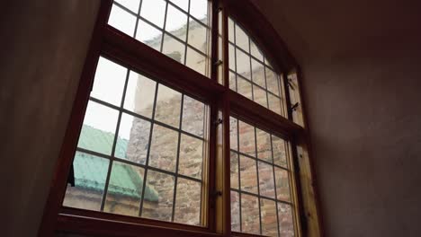 old window in a medieval castle. reveal shot