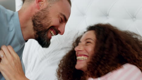 funny, playful and love couple on bed tickling