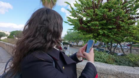 tourist enjoying a selfie moment in historic jerusalem. slow motion.
