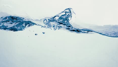 many bubbles in water close up, abstract water wave with bubbles in slow motion