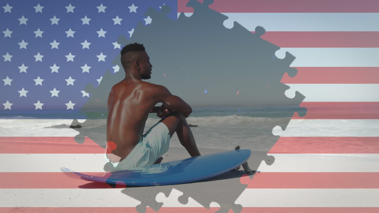 animación de fuegos artificiales y rompecabezas de bandera estadounidense que revelan a un hombre sentado en la playa
