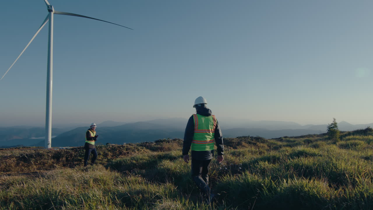 Two Engineers Meeting in the Morning at Wind Farm