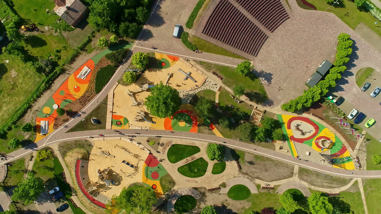 Aerial view of the colorful Uzvaras parks, with playground and green trees in Jelgava, Latvia