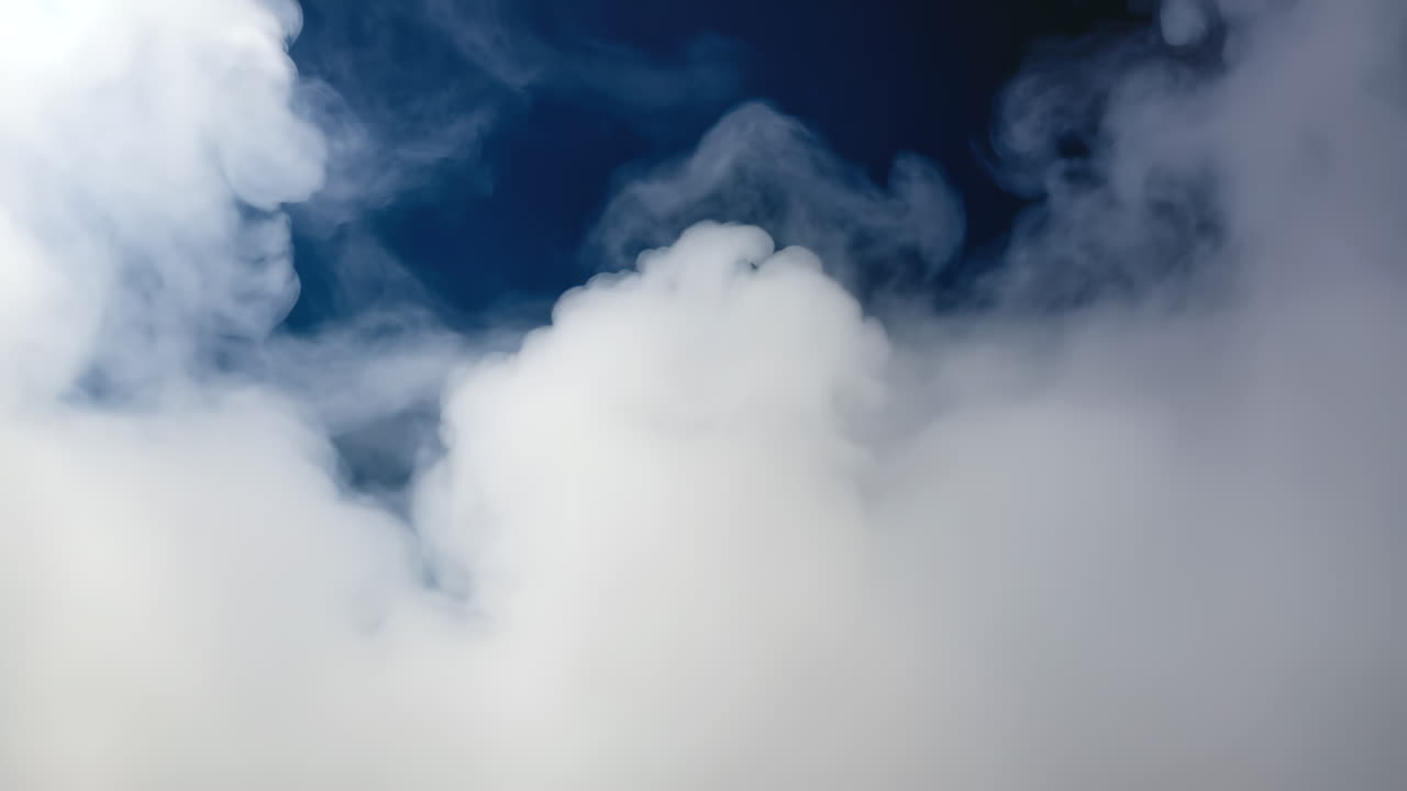 Dense fog drifting slowly and organically across the frame. Creates an eerie, mysterious Halloween atmosphere. Ideal cinematic background for spooky or horror themes.