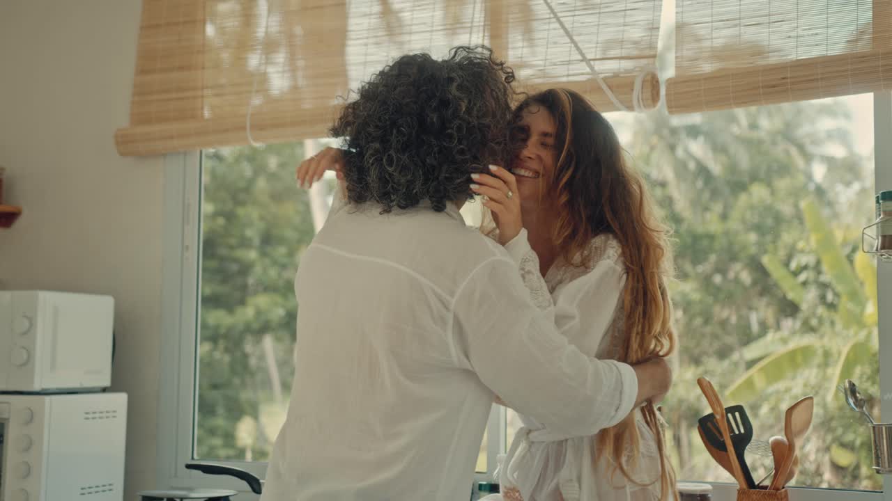 Couple Enjoying Time Together in a Tropical Kitchen
