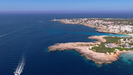 Aerial Drone panoramic Cala en Bosch Beach, Menorca Spain, Mediterranean Summer Day
