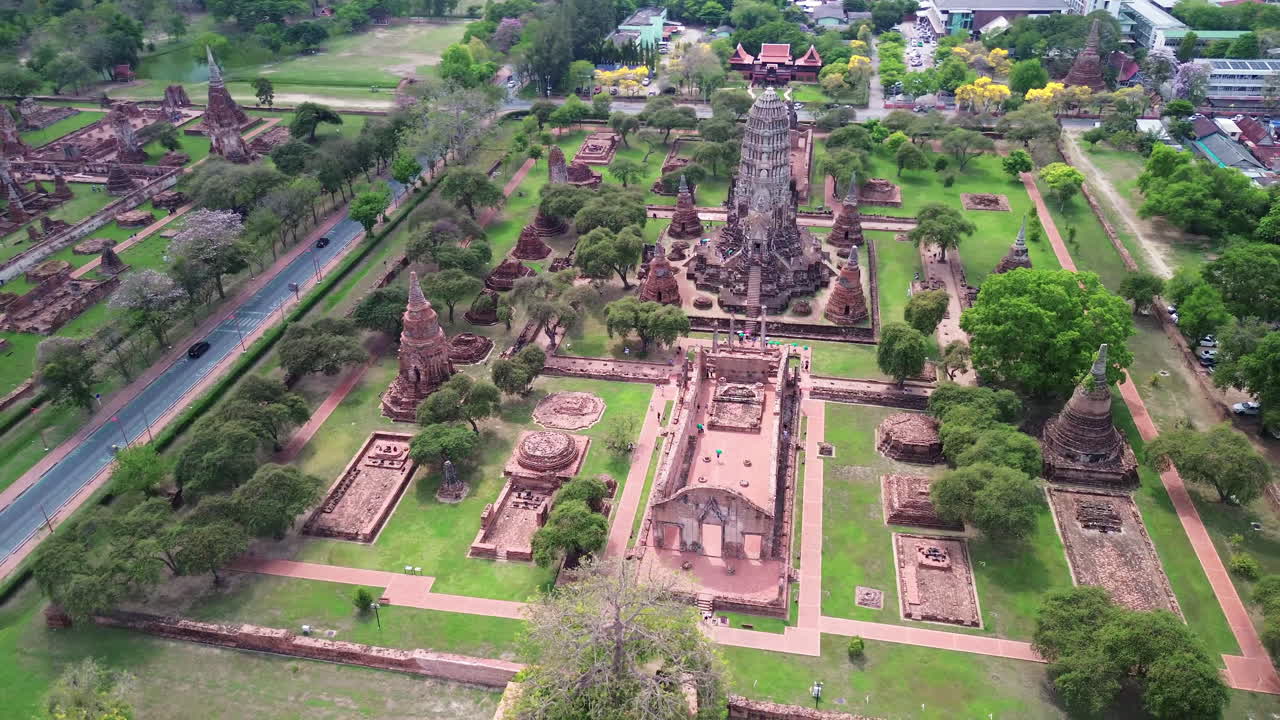 High angle wide overview of temple layout and ancient Buddhist ruins in Ayutthaya, Thailand