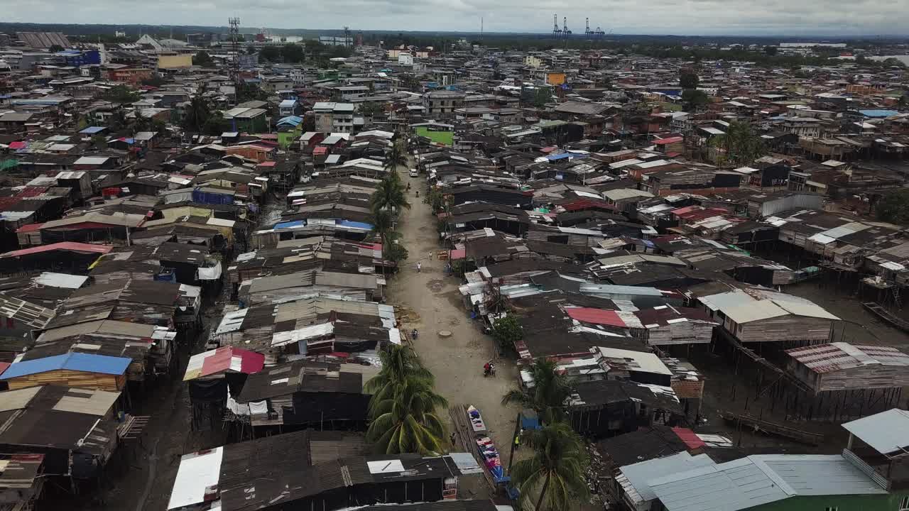 Aerial flying back over the Humanitarian Space Puente Nayero in Buenaventura, Colombia