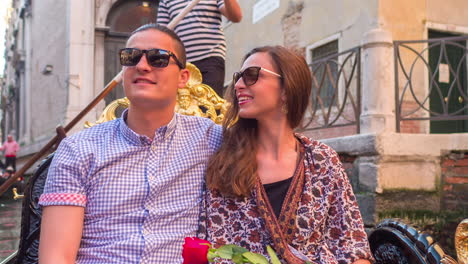 couple enjoying a gondola ride in venice