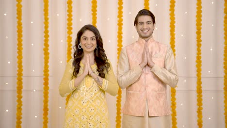 indian couple doing namaste