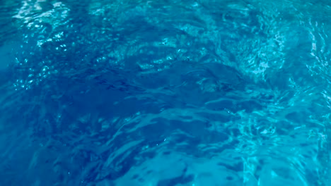 closeup of fast cyan crystal clear water purification in 4k