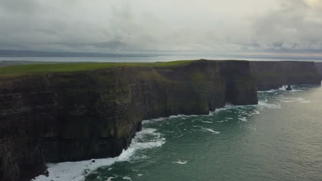 dramatic aerial view of the cliffs of moher, ireland