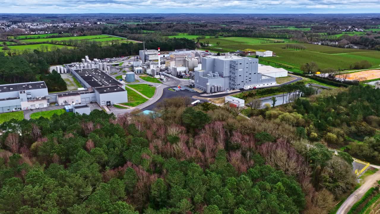 High-Angle Drone Shot of Large-Scale Industrial Factory in Rural Landscape
