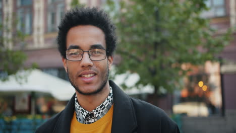 smiling man in city street