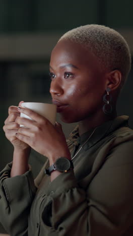 woman with short grey hair drinking coffee