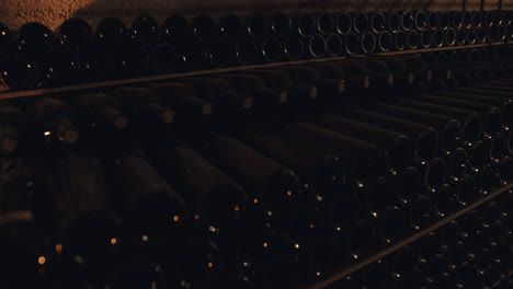 Slow-motion-shot-of-wine-bottles-stacked-in-a-subway-container-in-Burgos,-Spain