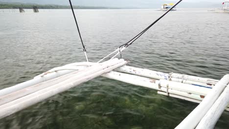 Passenger-view-on-travel-boat-moving-on-shallow-water-while-leaving-dock