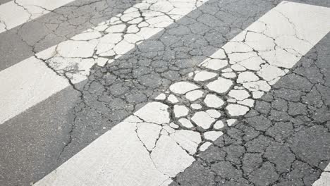 cracked pavement on crosswalk