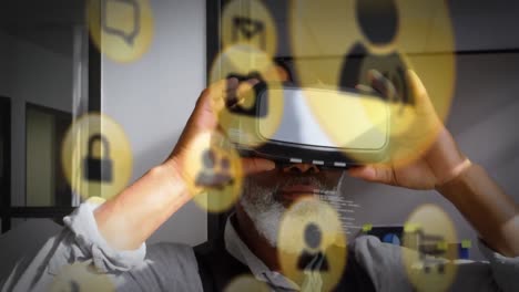 animation of data processing and social media icons over african american man wearing vr headset